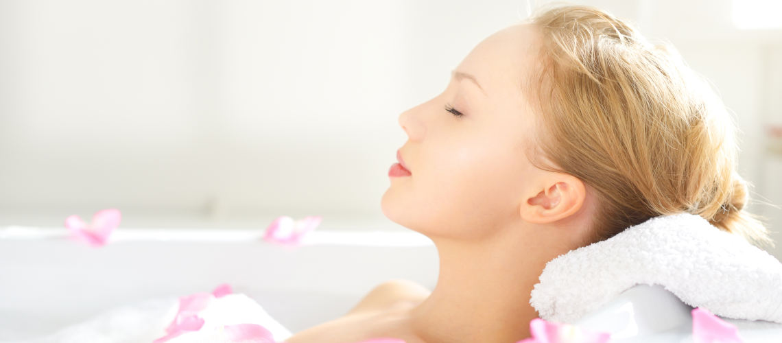 Girl,Relaxing,In,Bathtub,On,Light,Background